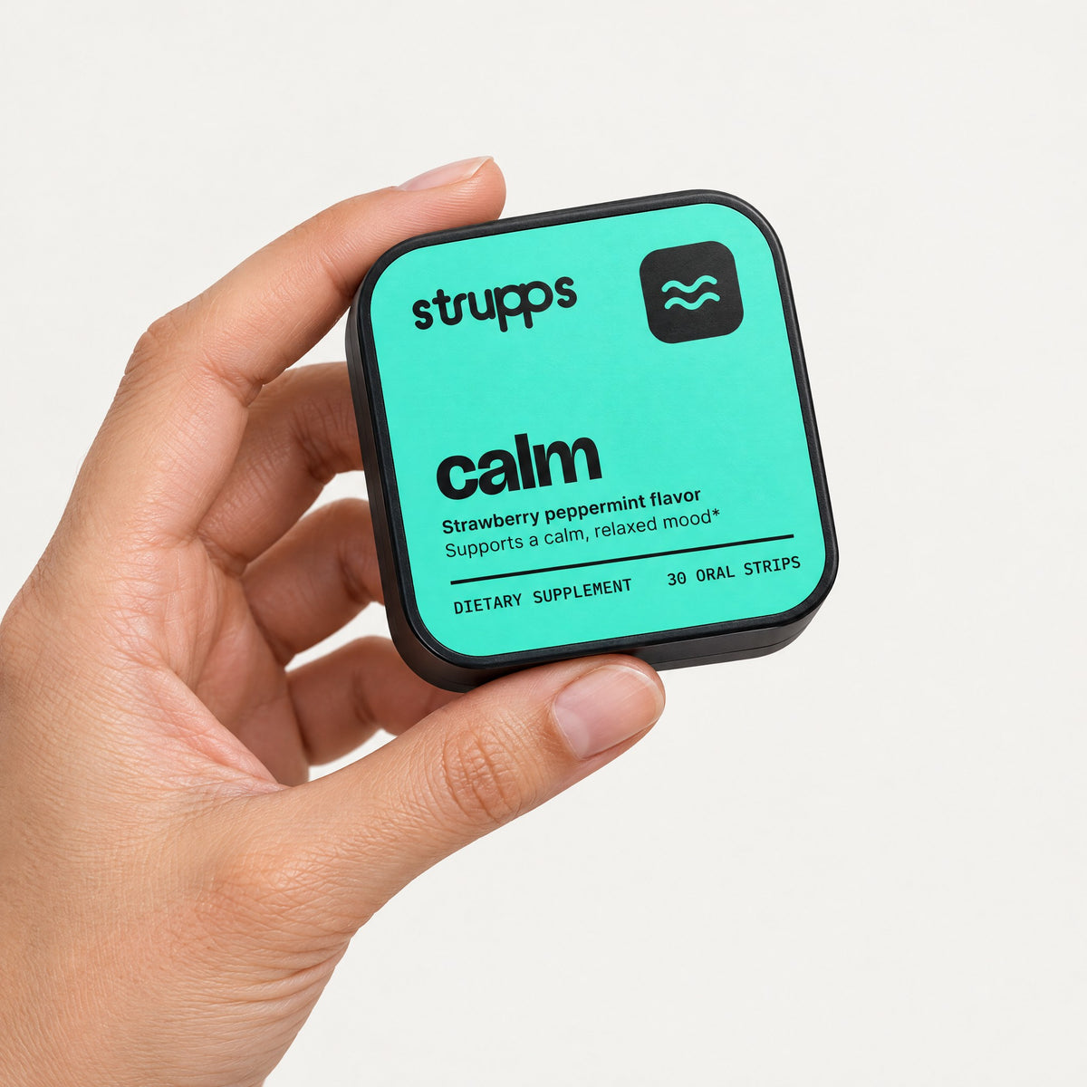 The Calm Strip tin held in hand