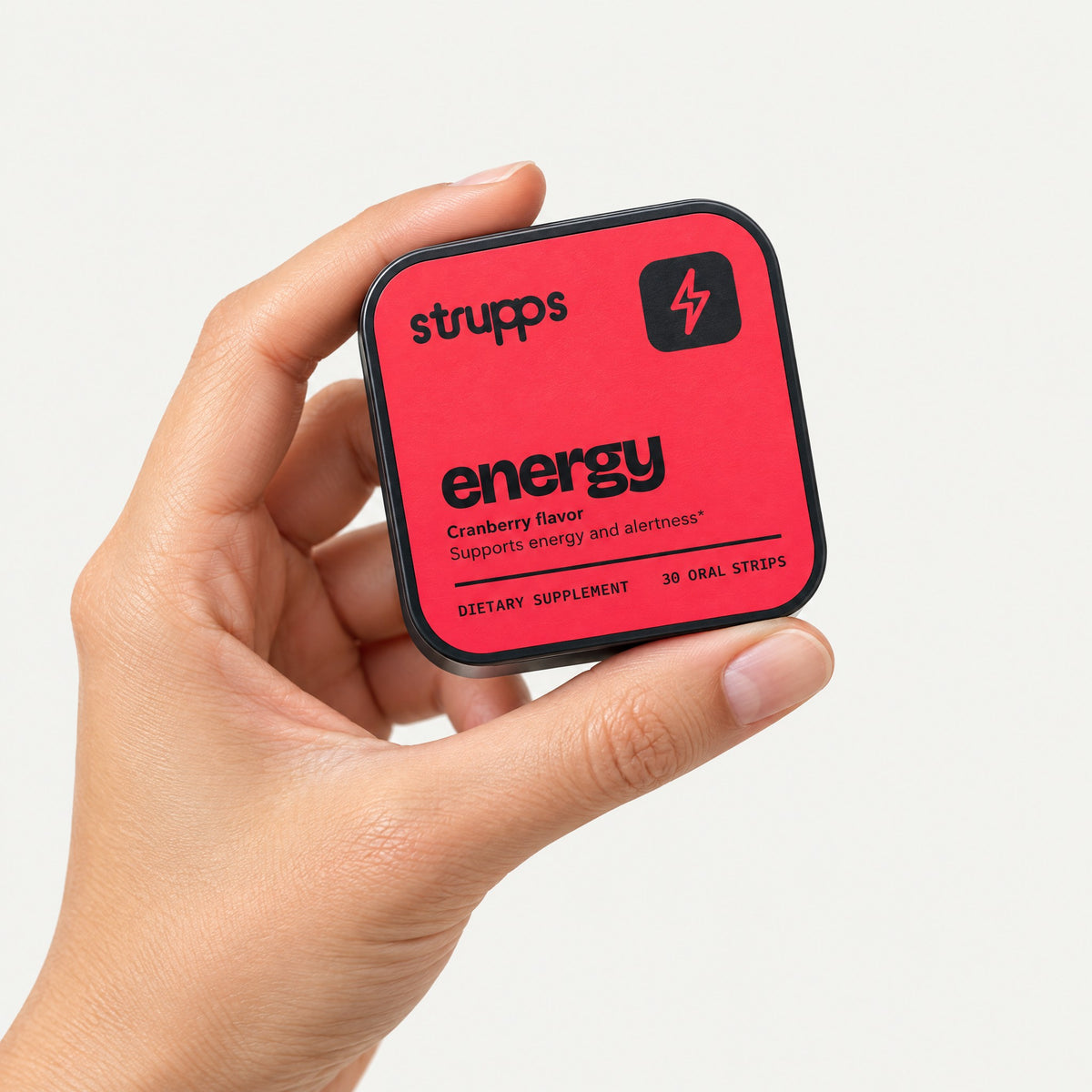 The Energy Strip tin held in hand